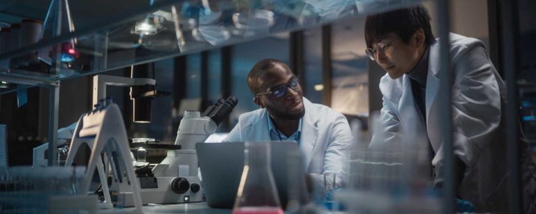 Black Health Researcher & Asian Health Researcher in a lab