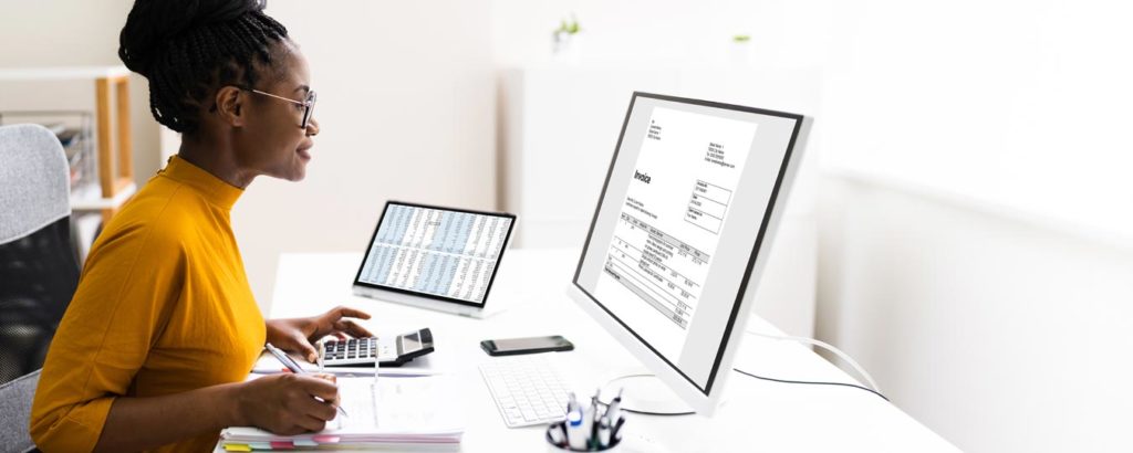 Black Female accountant working at her desk