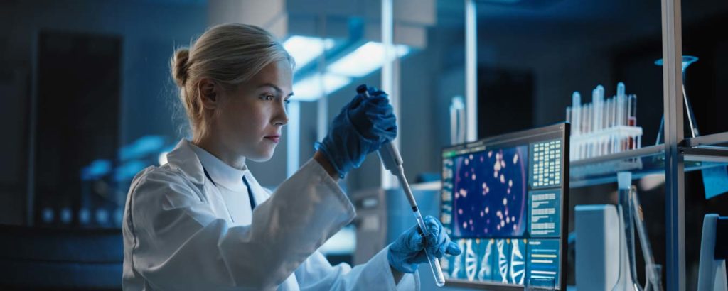 Scientist working in research lab funded by NIH