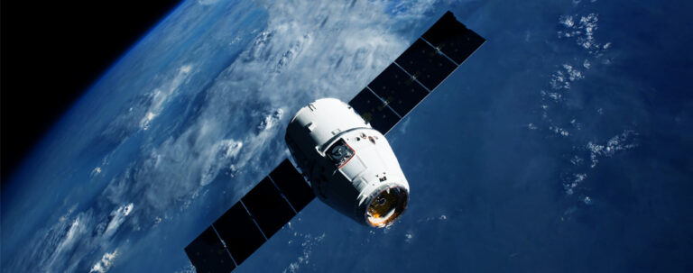 Satellite orbiting above Earth with solar panels extended.